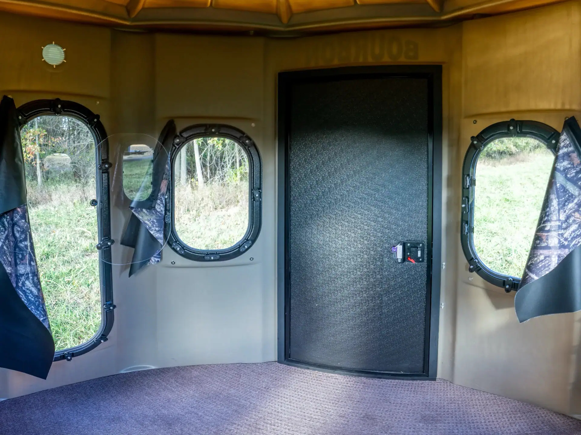 Inside White Oak Combo XT Blind with combo gun and bow windows and a side door