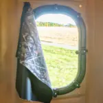 Open gun window curtain on XT Blind