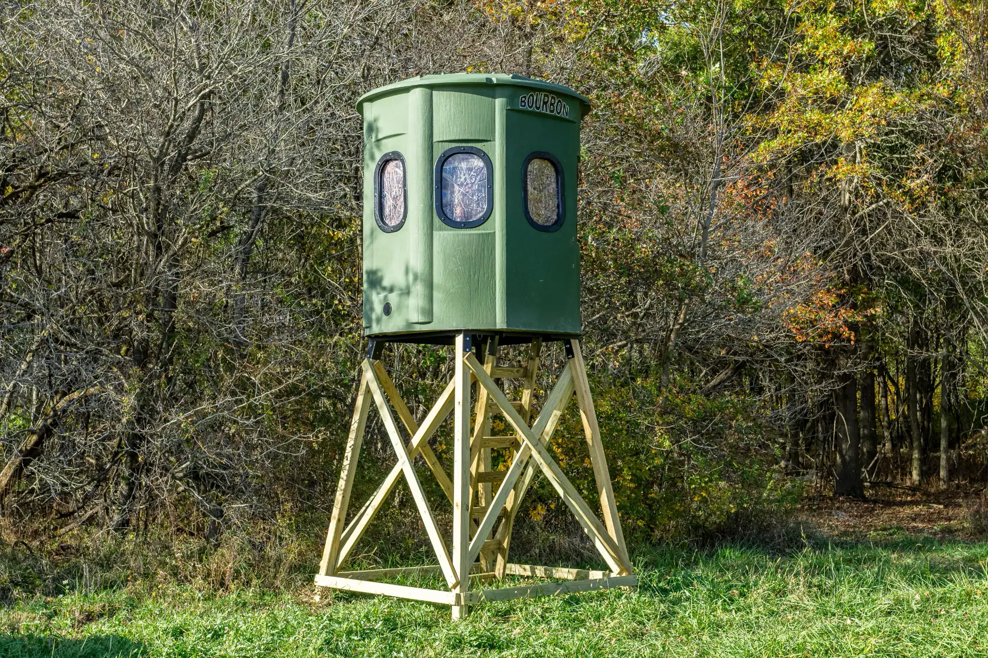 Poplar Gun XT Blind in Forest Green with gun windows and trap door set by edge of woods