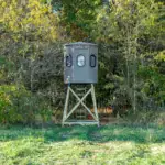 Tree Trunk Poplar Gun XT Blind with trap door and gun windows sitting in woods