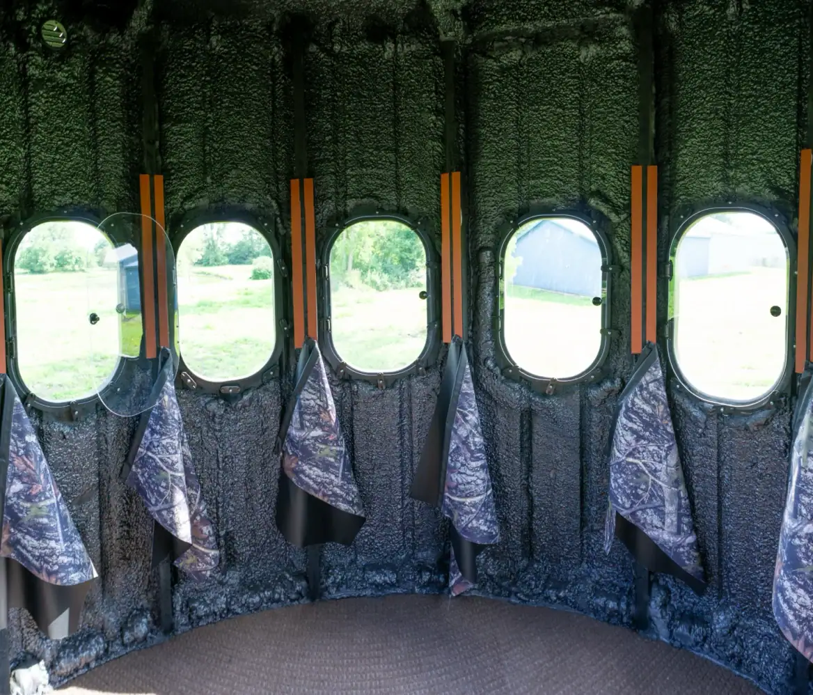 Inside The Ultimate Blind with 360 degree view outside with curtains hanging below windows