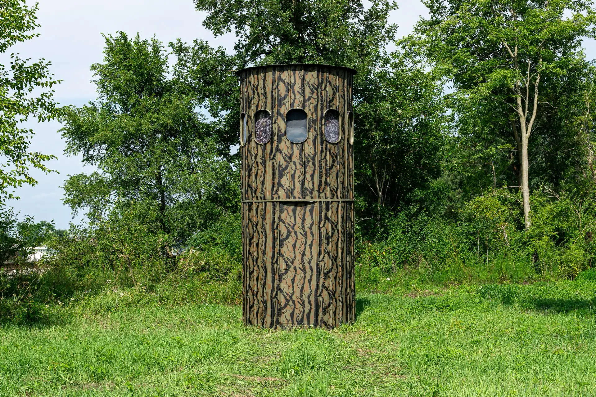 The Ultimate Blind set at the corner of a woods