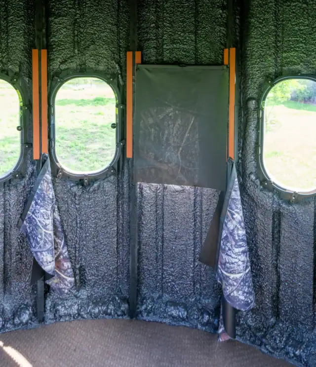 Inside The Ultimate Blind with one window covered by a curtain