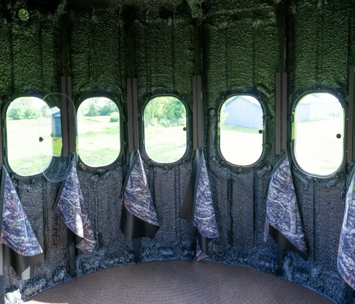 Inside The Ultimate Blind with 360 degree view outside with curtains hanging below windows