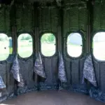 Inside The Ultimate Blind with 360 degree view outside with curtains hanging below windows