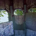 The Ultimate Blind from inside with magnetic curtains partially covering windows at different heights