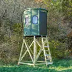 White Oak XT Blind in Forest Green with gun windows and side door set by edge of woods