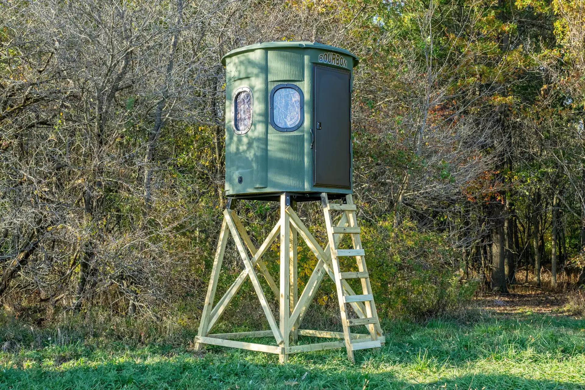 White Oak XT Blind in Forest Green with gun windows and side door set by edge of woods